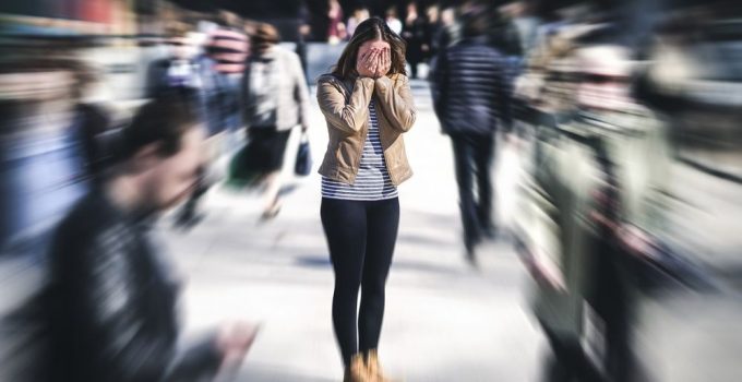 Woman trying to control her ever increasing anxiety in public.